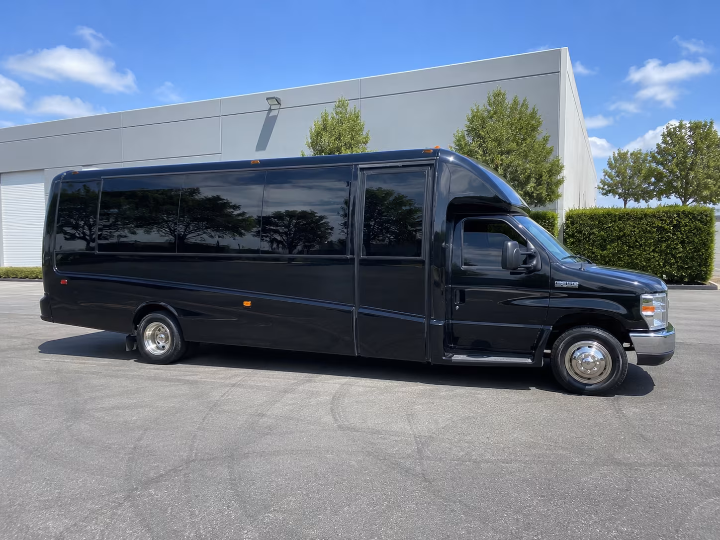 Friends laughing during a party bus celebration in Kansas City